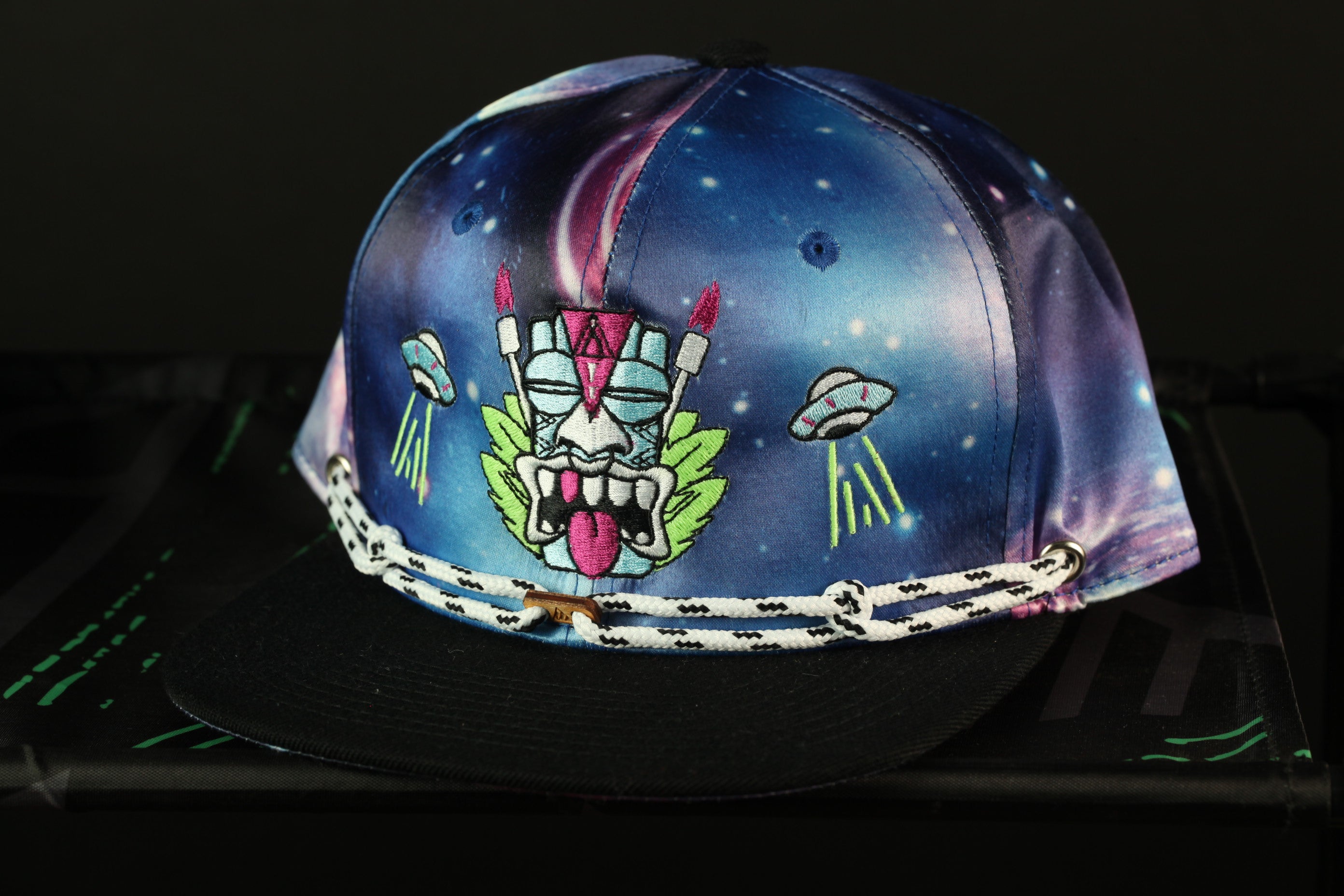 A colorful, patterned baseball cap with a graphic design on the front.