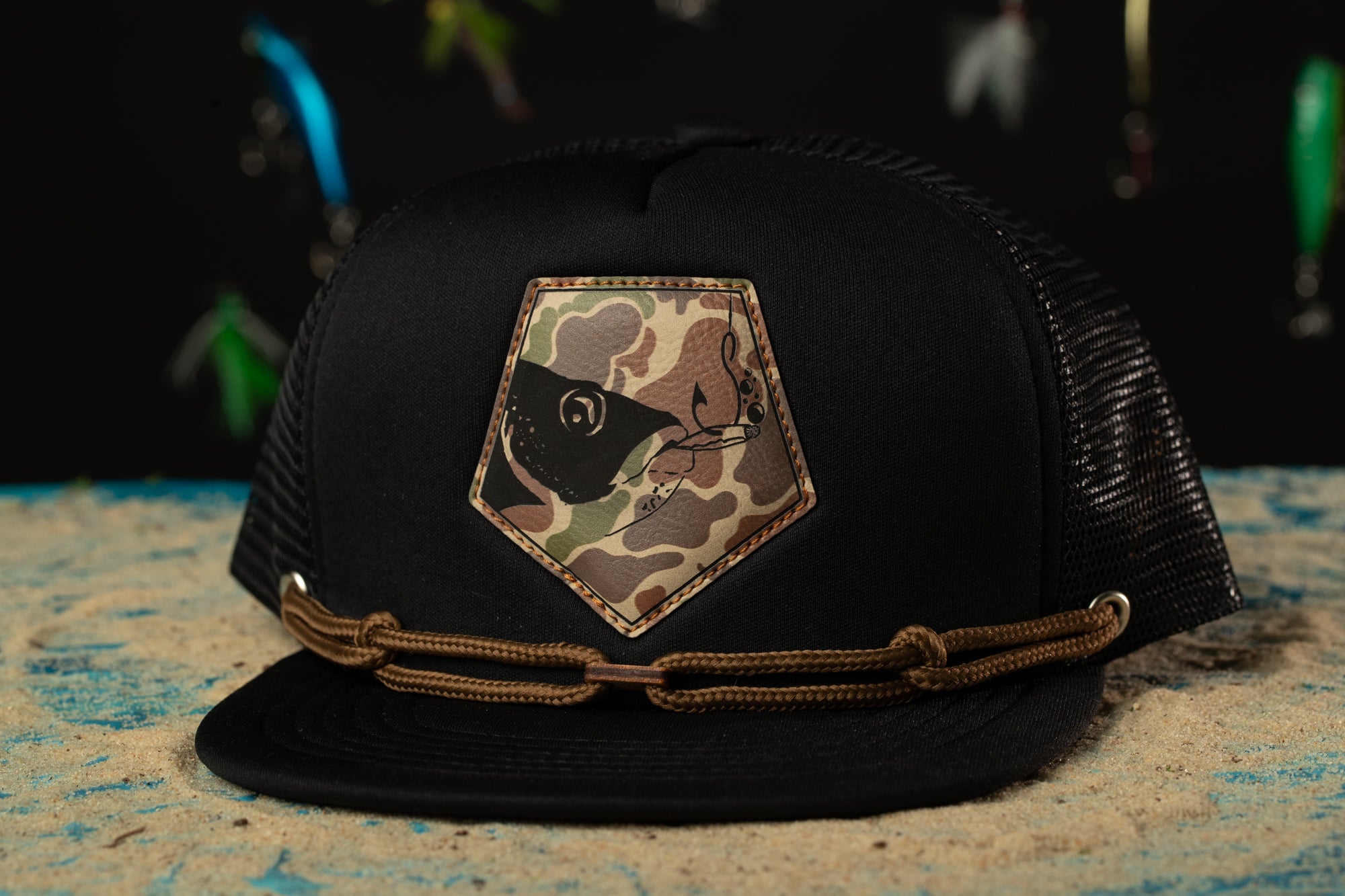 a black hat with a camo patch on it