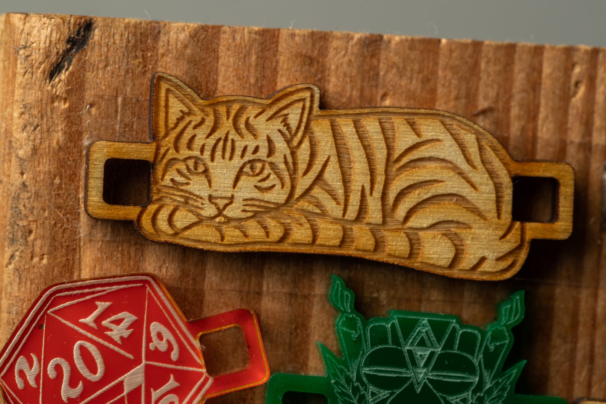 a wooden cat-shaped object, which appears to be a decorative piece or a charm.