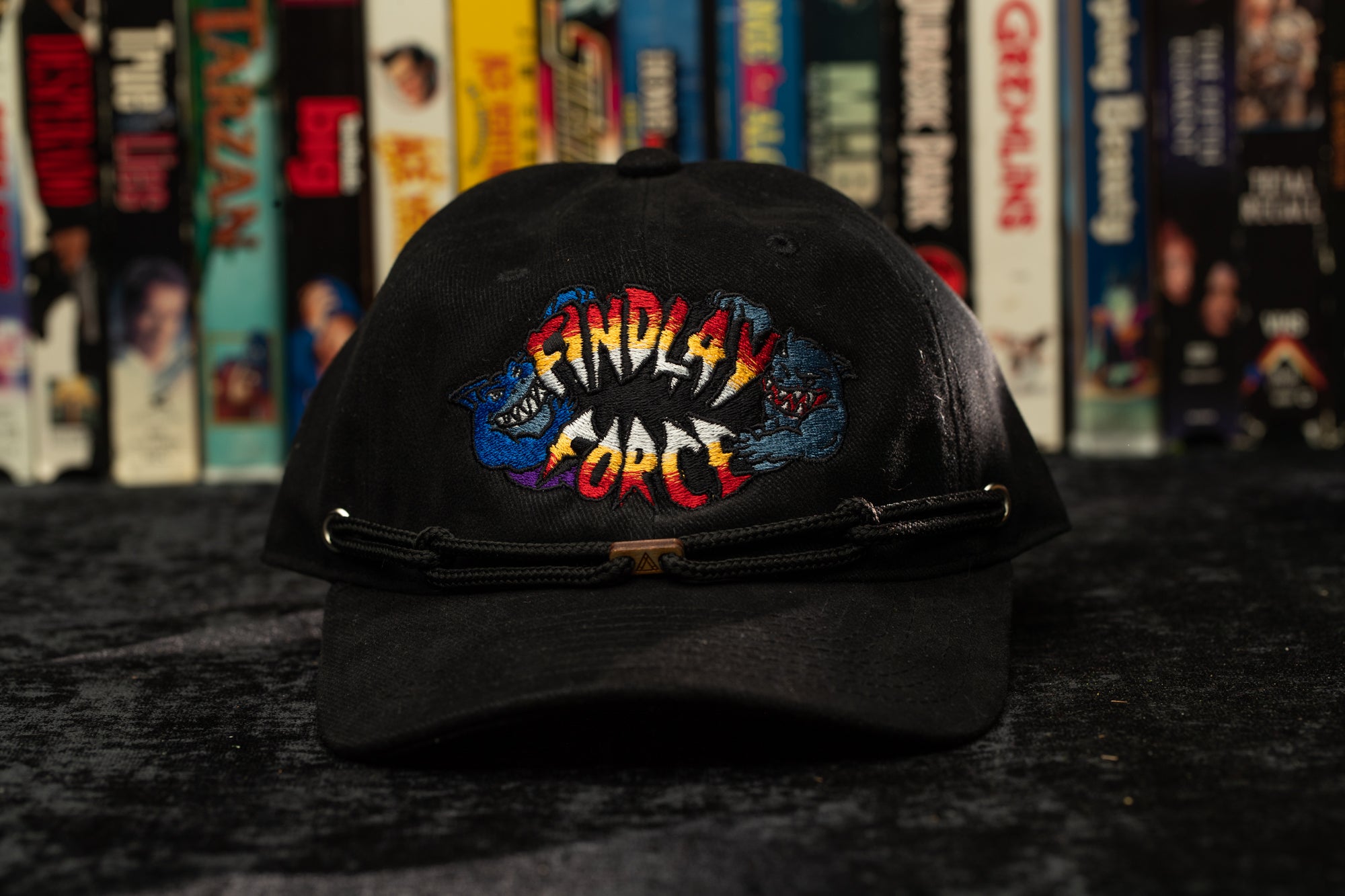 a black hat with a batman logo on it