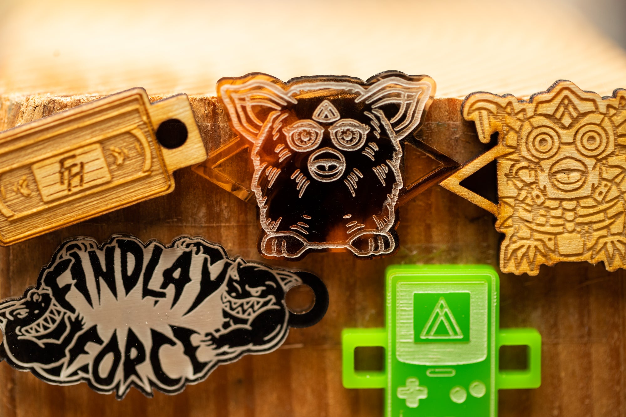 a bunch of stickers that are on a wooden surface