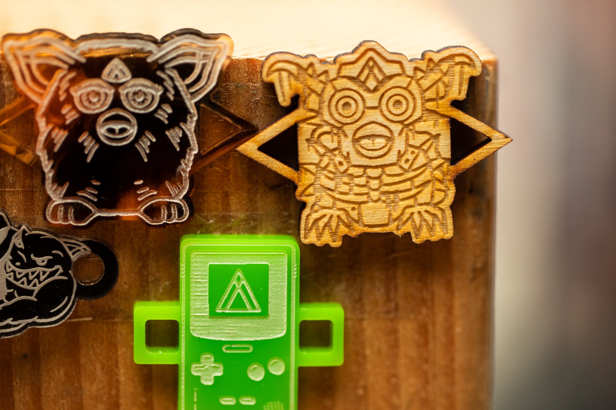 a group of wooden magnets with different designs on them