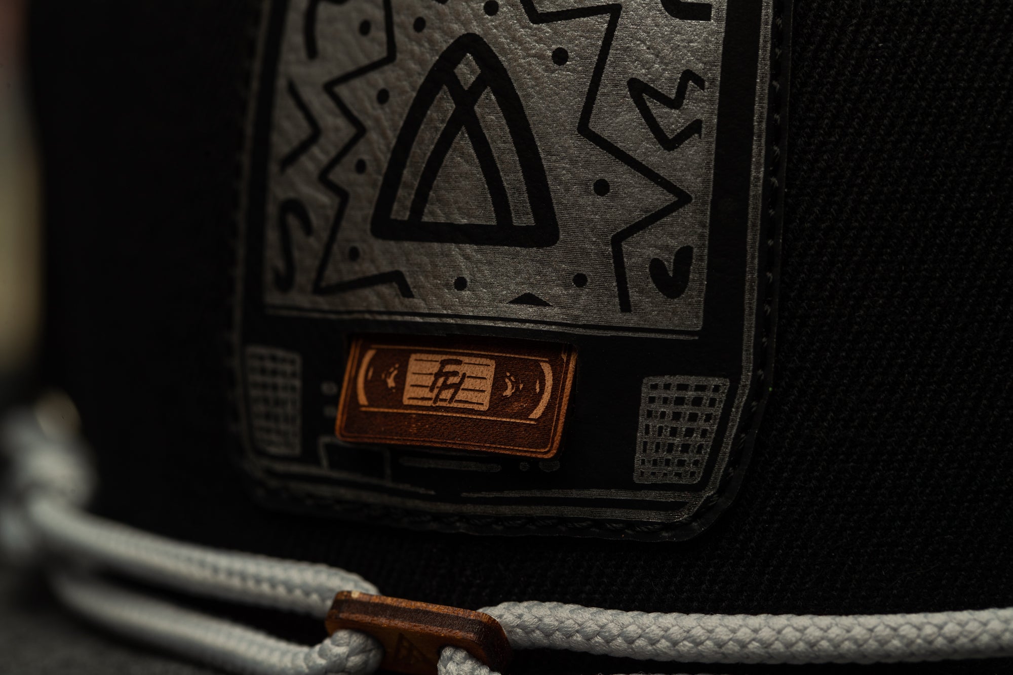 a close up of a black and white hat
