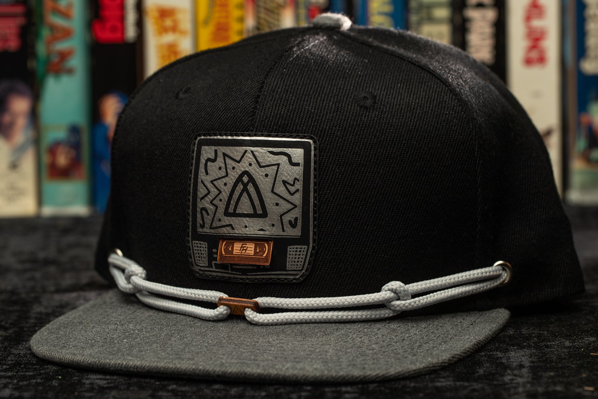 a black hat with a white string around it