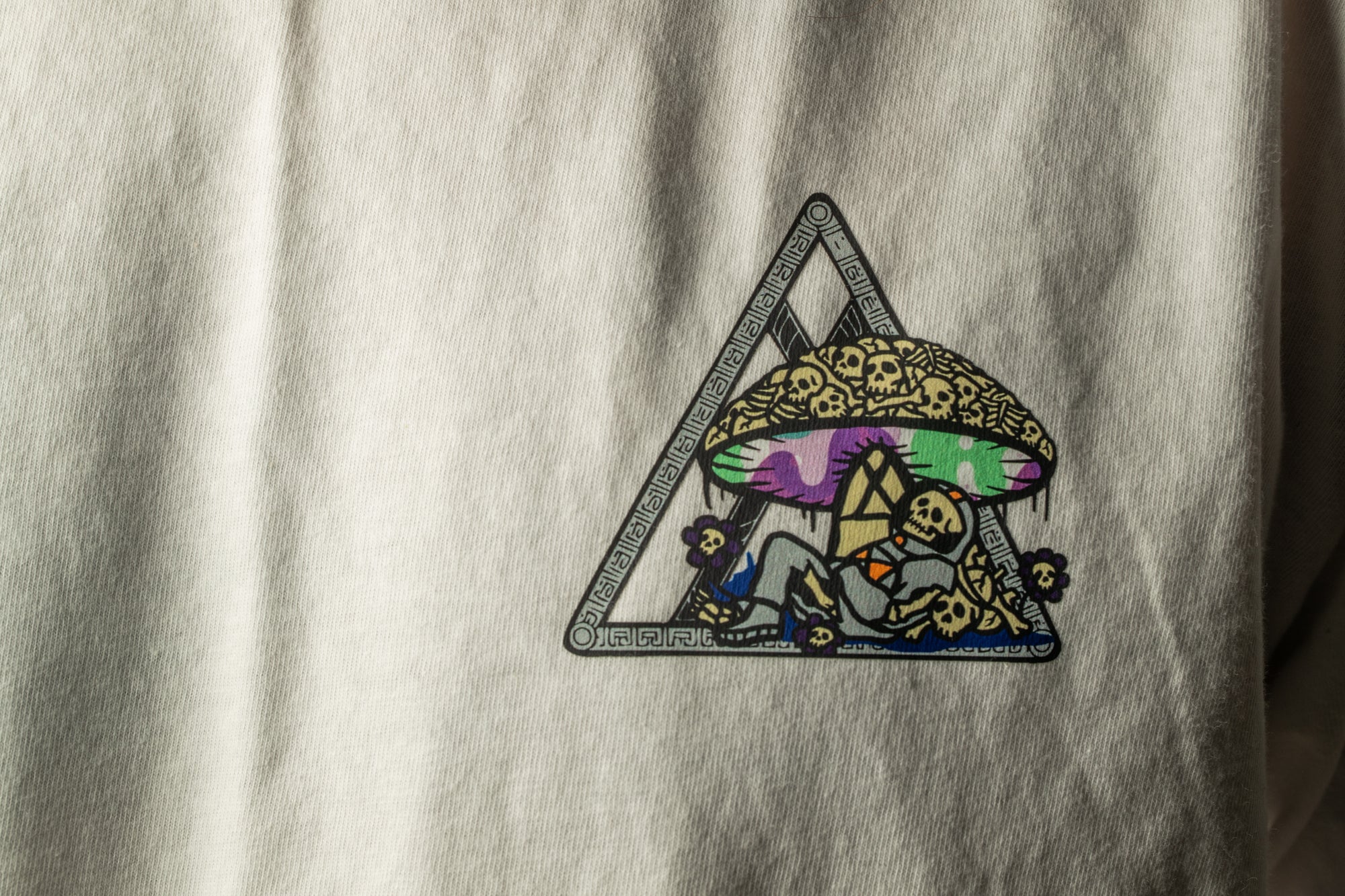 a white t-shirt with a colorful, abstract design on it.