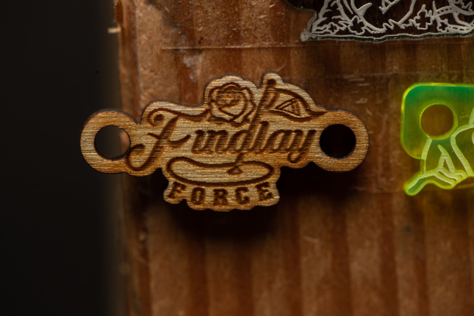 a couple of wooden key chains hanging on a wall