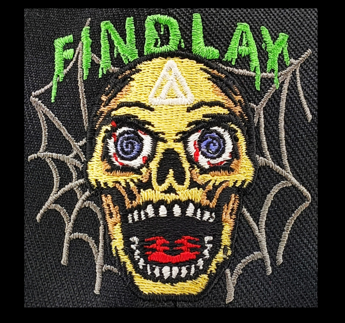 a close-up of a skull with a webbed foot, surrounded by a spider web. The text "FIND LAY" is prominently displayed above the skull.