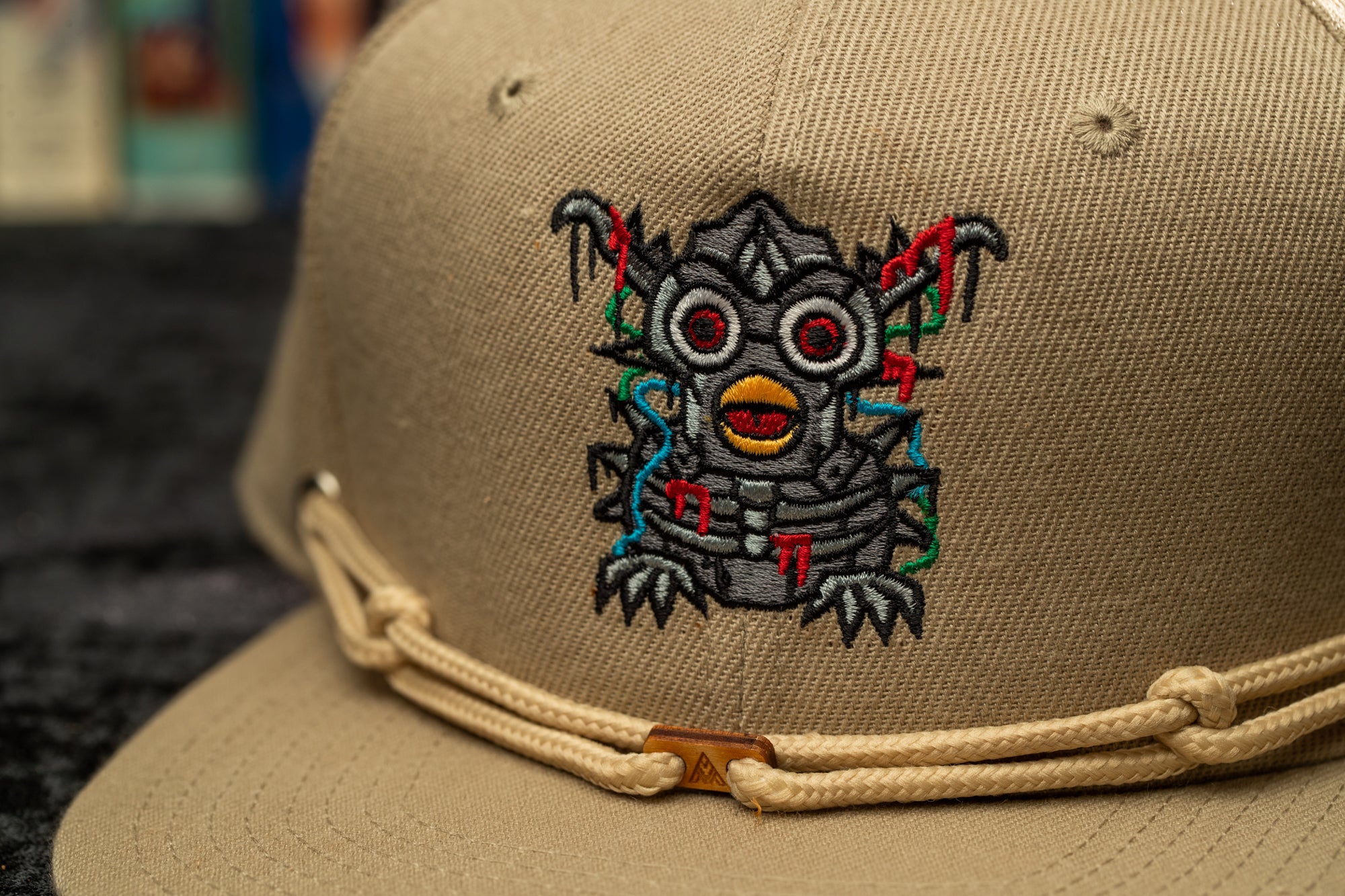 a baseball cap with a picture of a bird on it