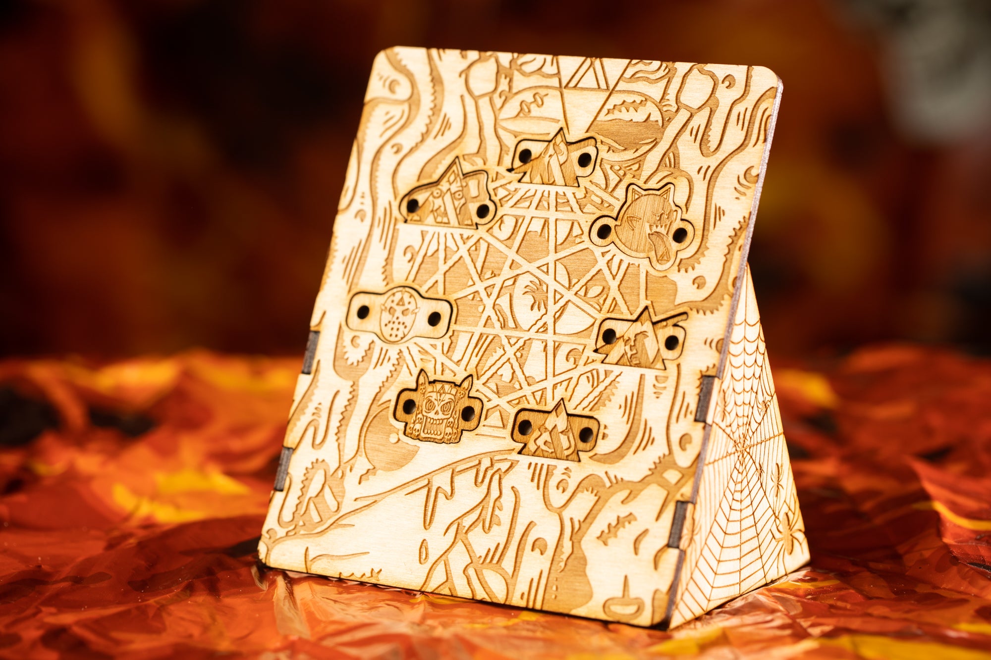 a wooden object with intricate designs and patterns carved into it, placed on a surface with a warm, reddish-brown background.