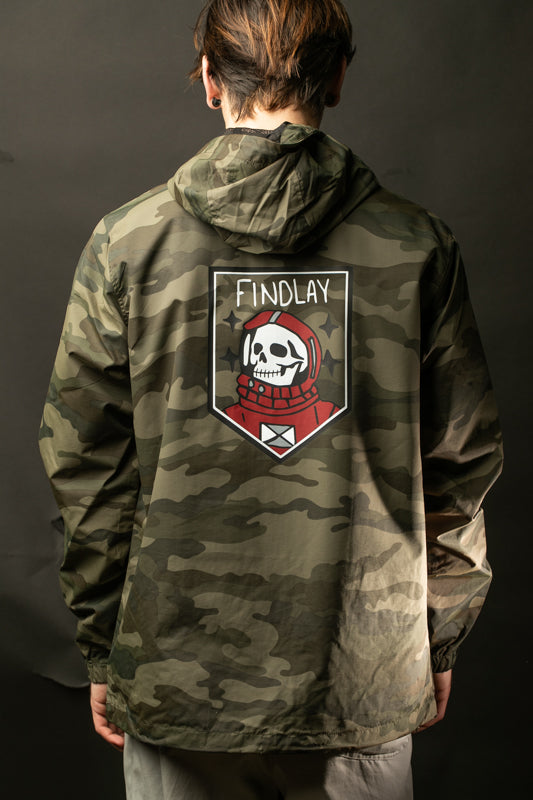 the back of a person wearing a camouflage jacket with a graphic design on the back.