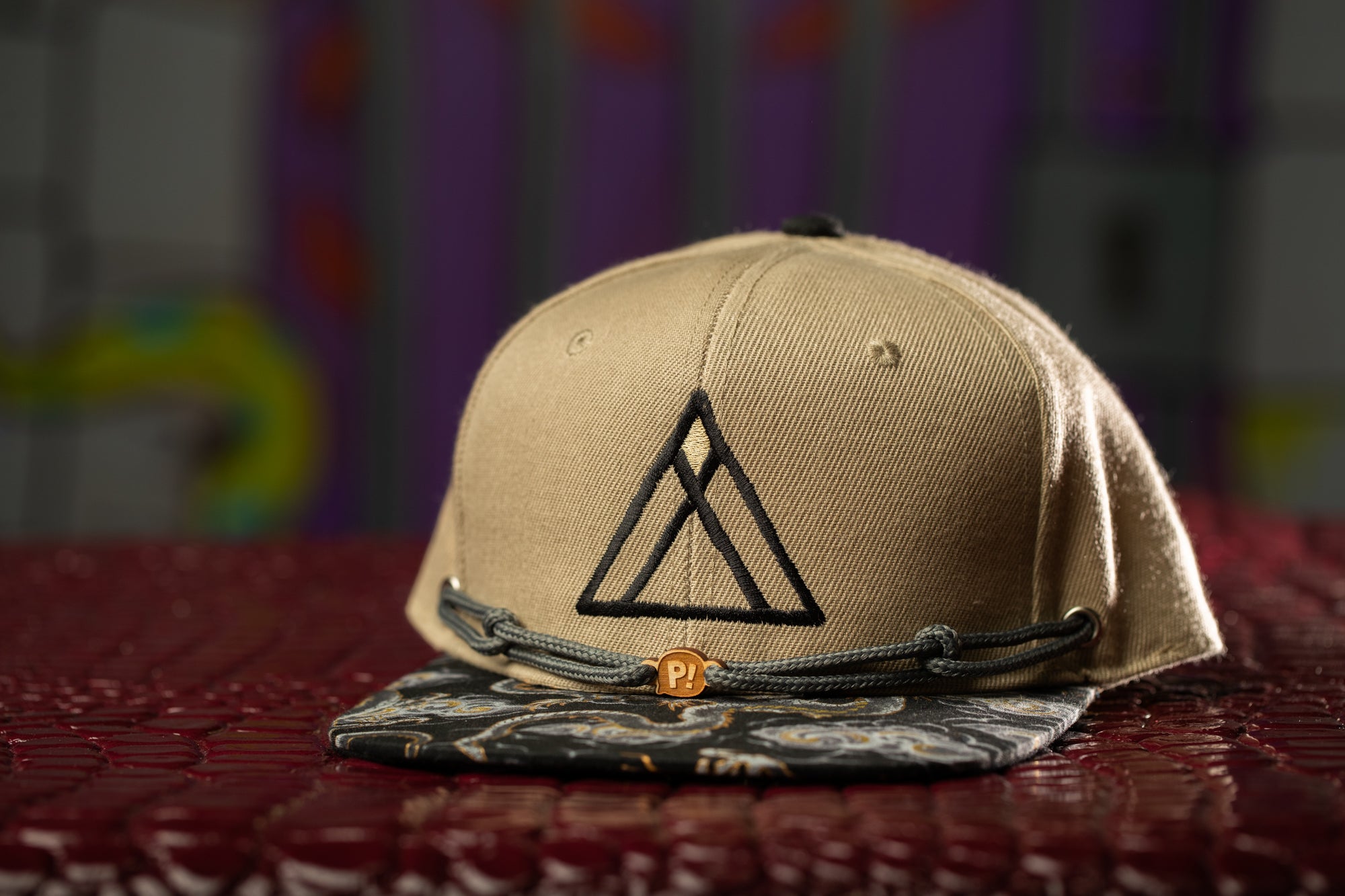 a hat with a triangle on it sitting on a table
