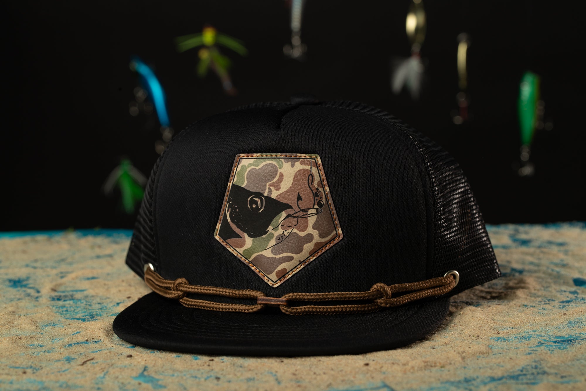 a black hat with a camo patch on it