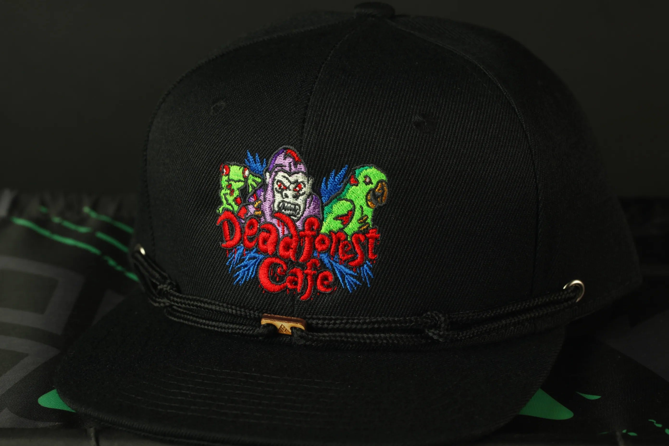 A black baseball cap with a colorful embroidered logo on the front.