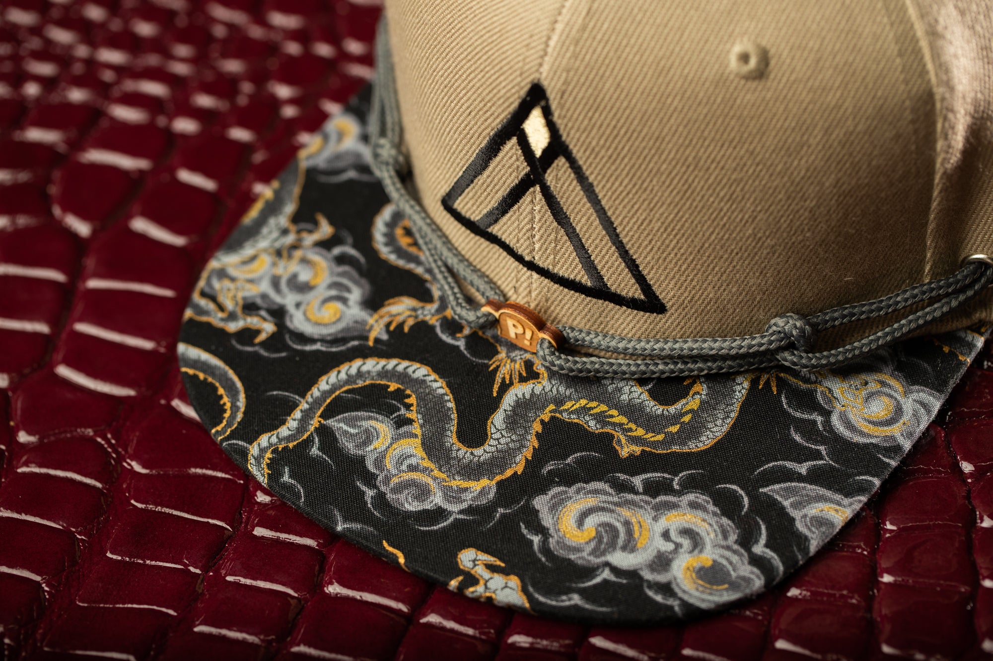 a baseball cap with a black triangle on it