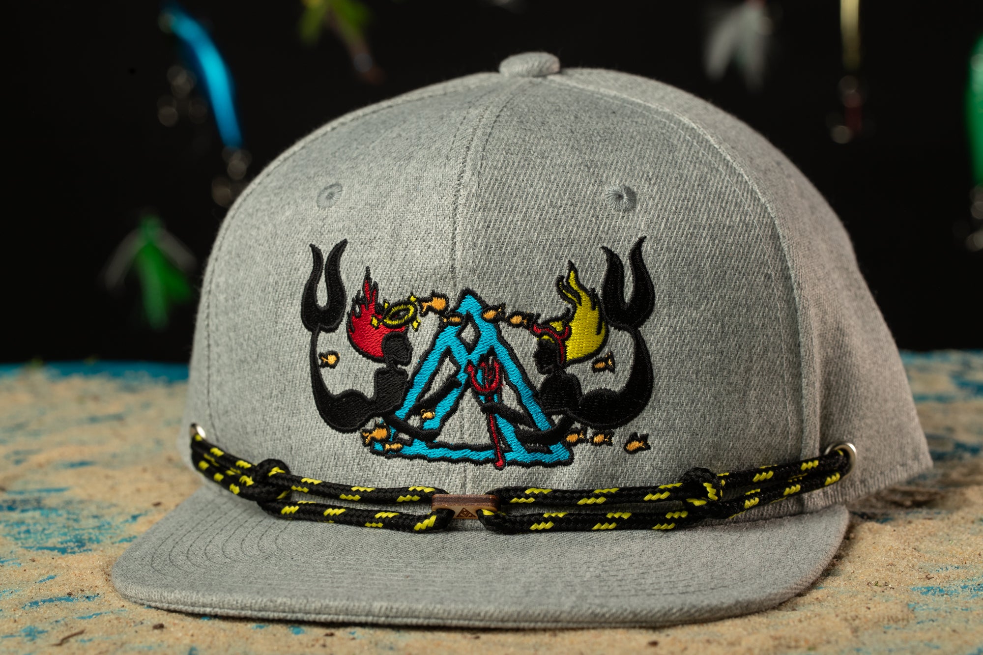 a gray hat with a picture of a triangle on it