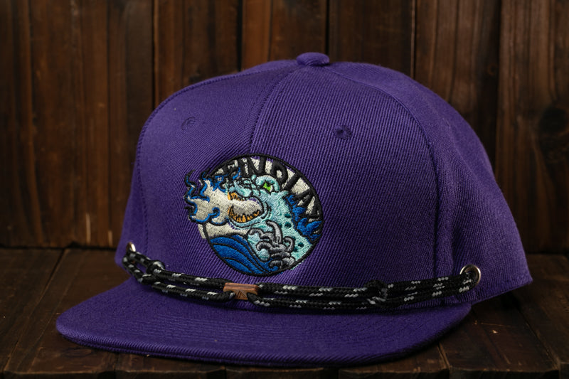 A purple baseball cap with a black and white braided strap and an embroidered logo on the front.
