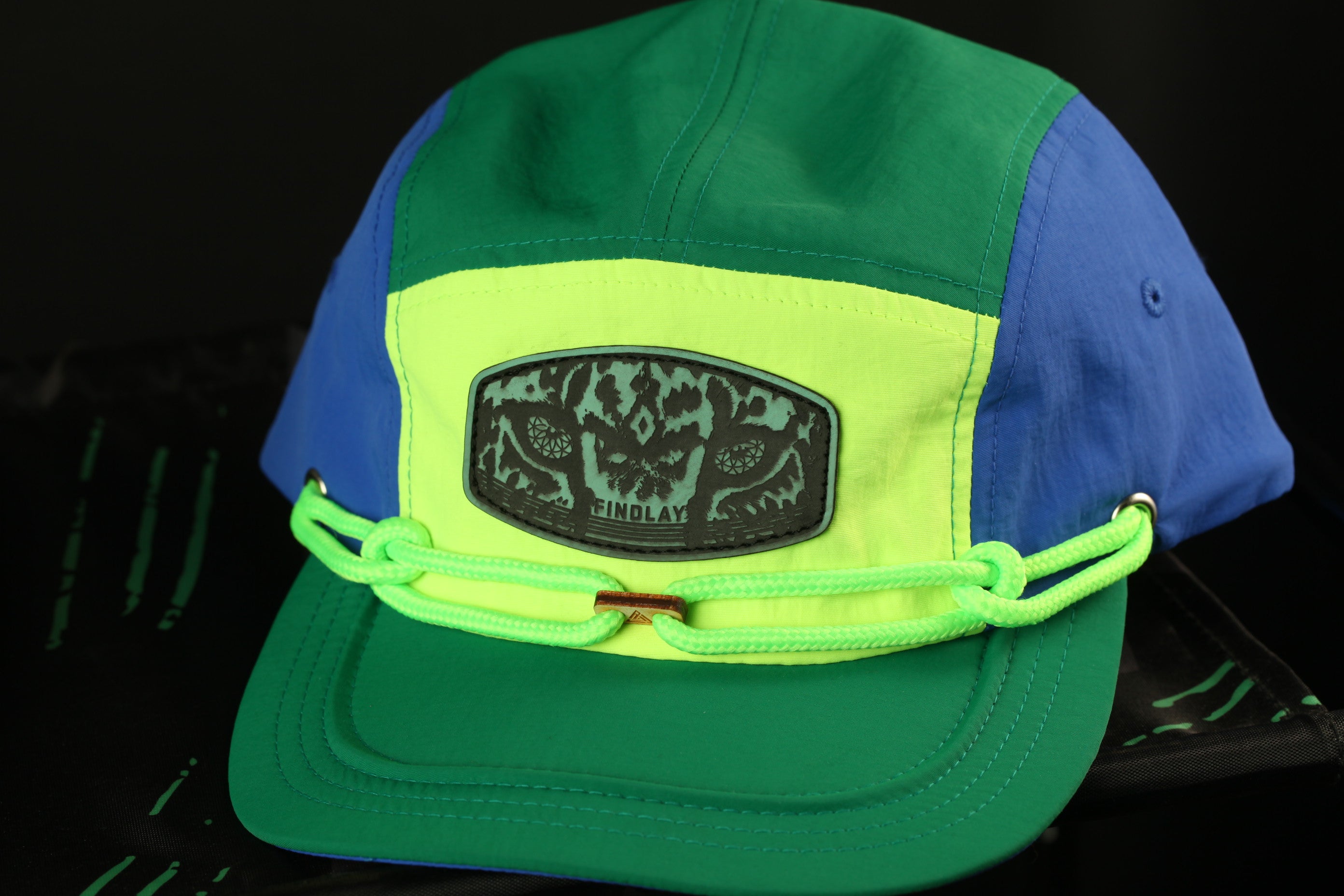 A colorful baseball cap with a patch on the front.