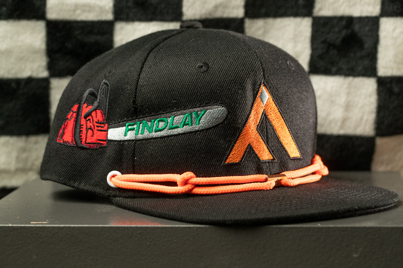 A black baseball cap with various embroidered designs and text on it.