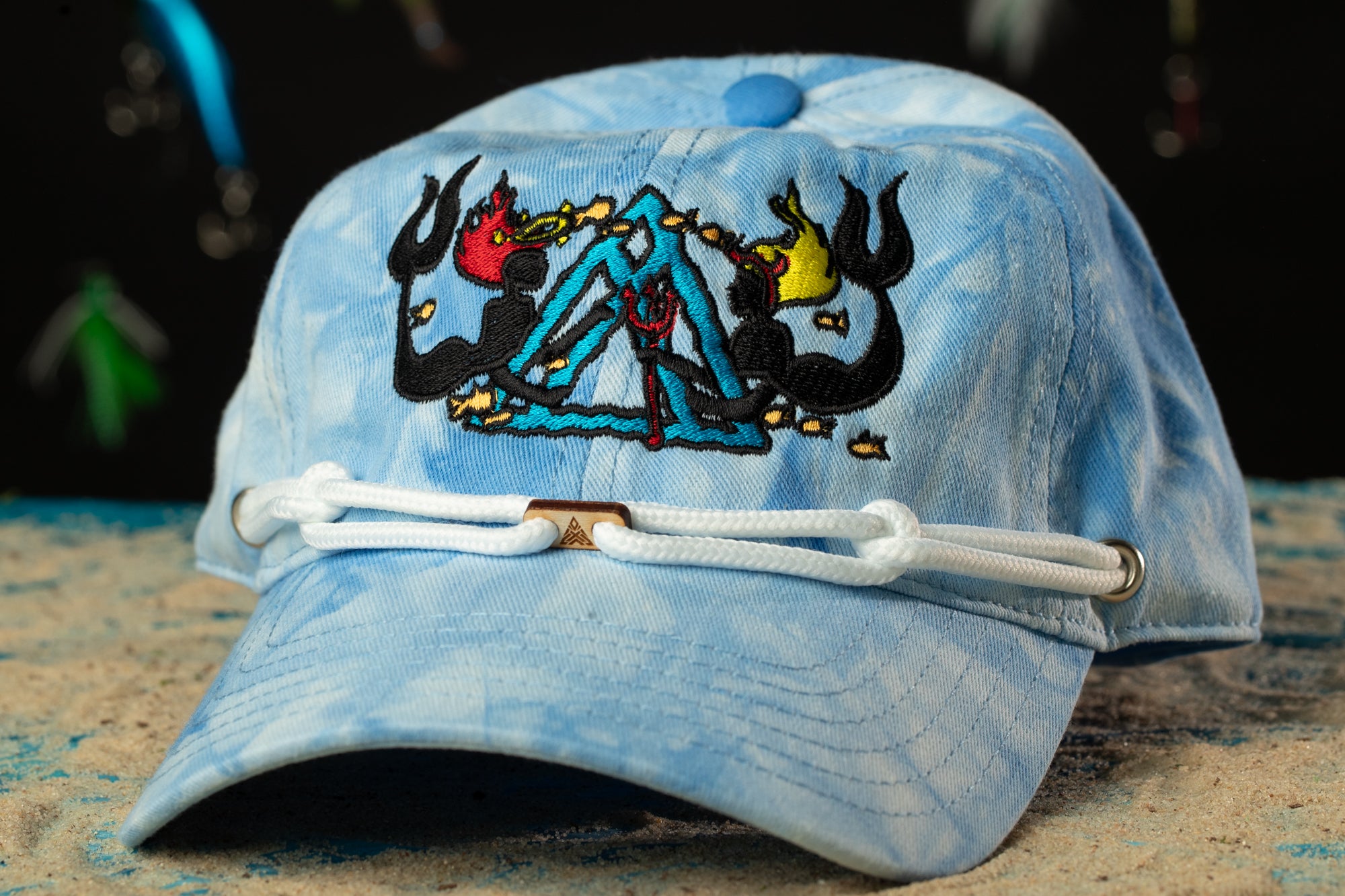 a blue hat with a picture of a tent on it