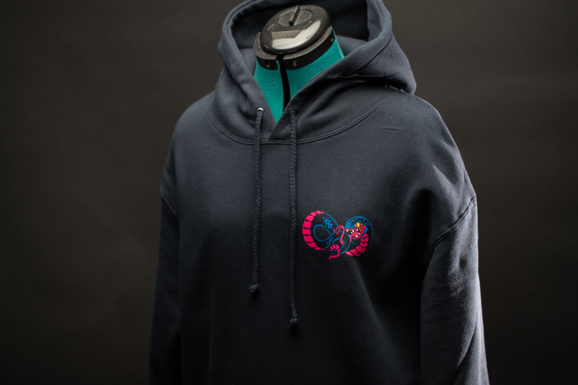 a black hoodie with a heart on it