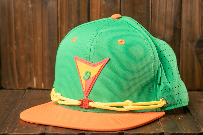 A green baseball cap with a yellow band and a red triangle patch displaying the number 9.