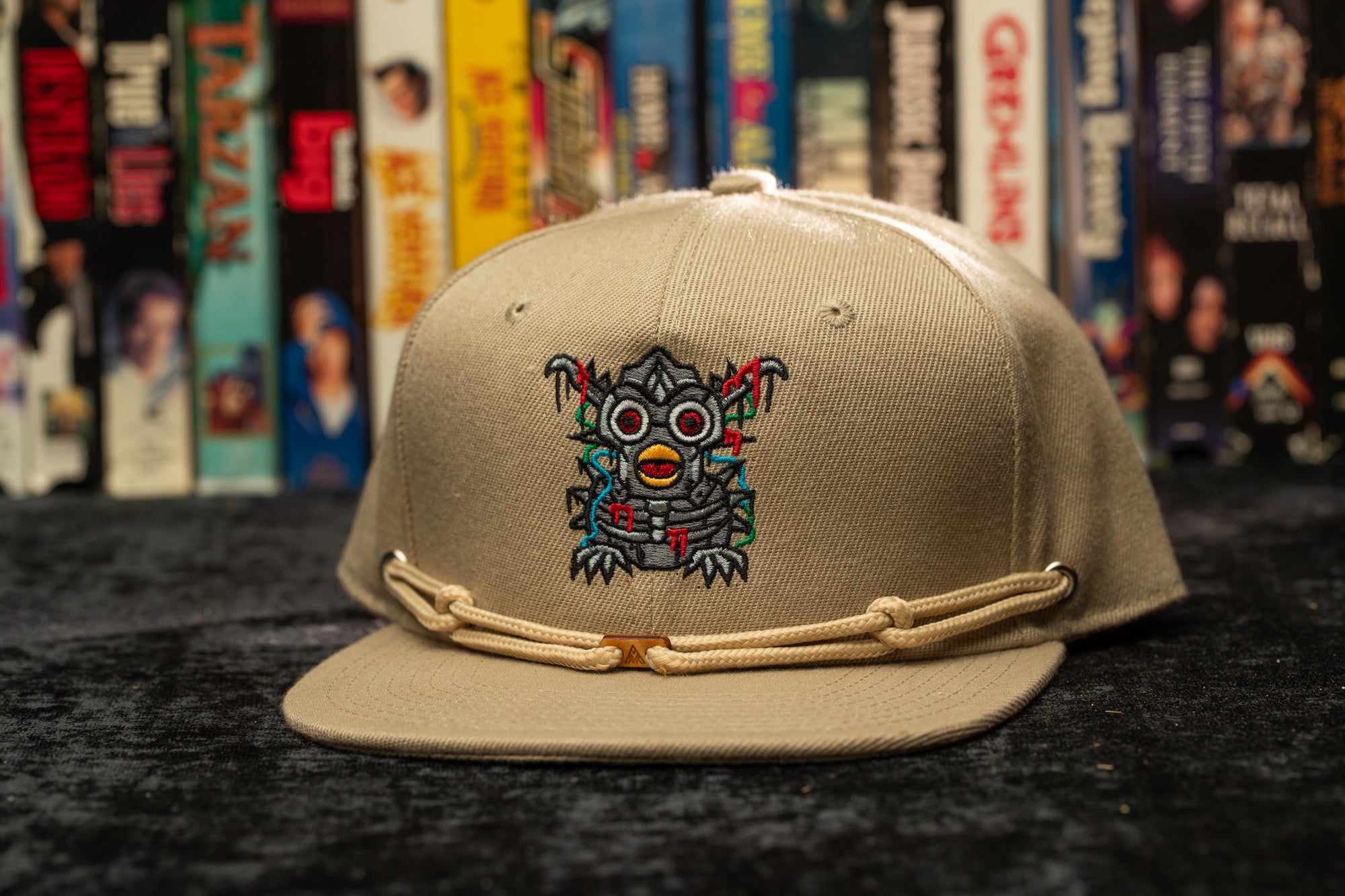 a baseball cap with a picture of a demon on it