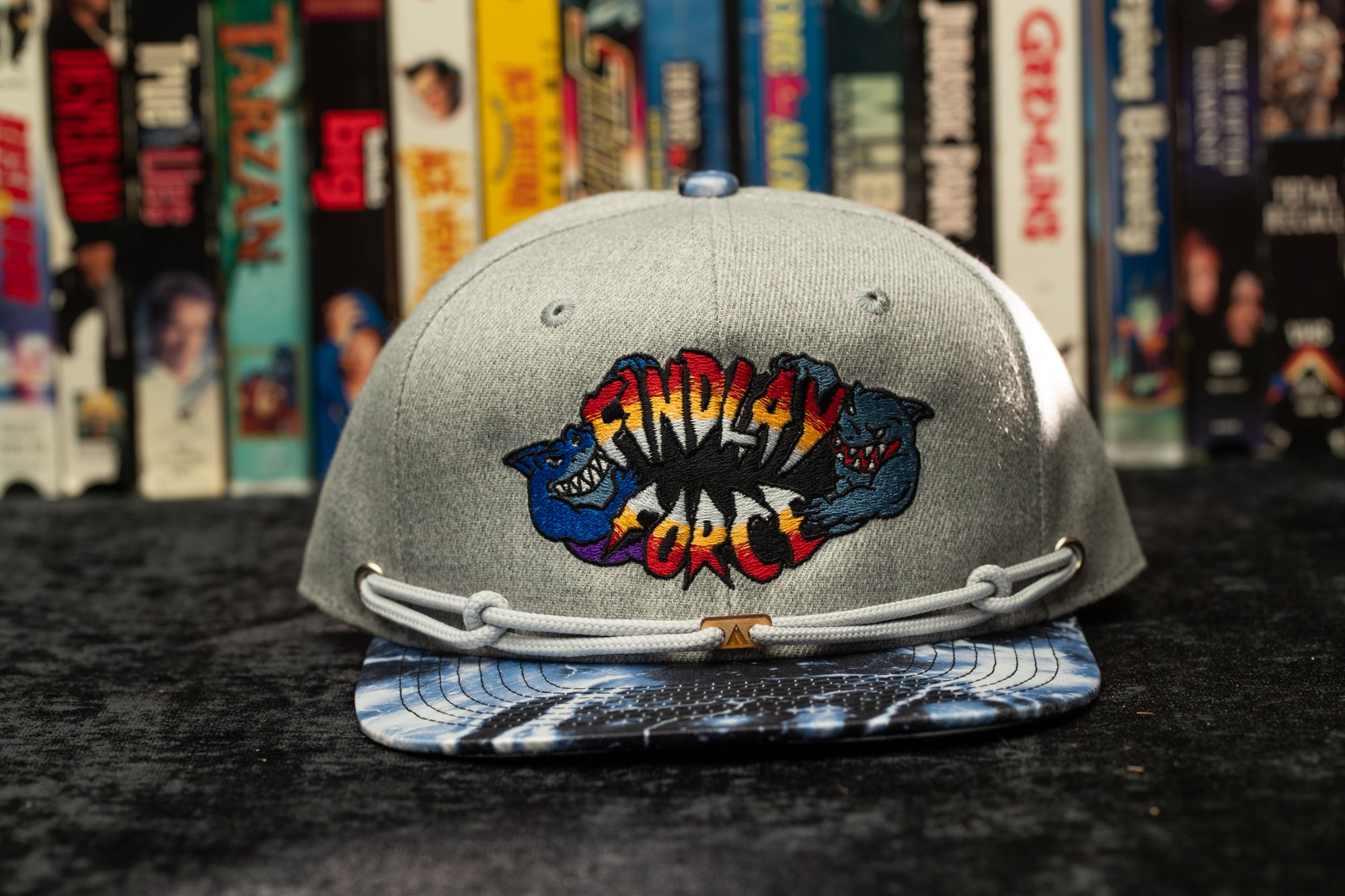 a baseball cap with a comic logo on it