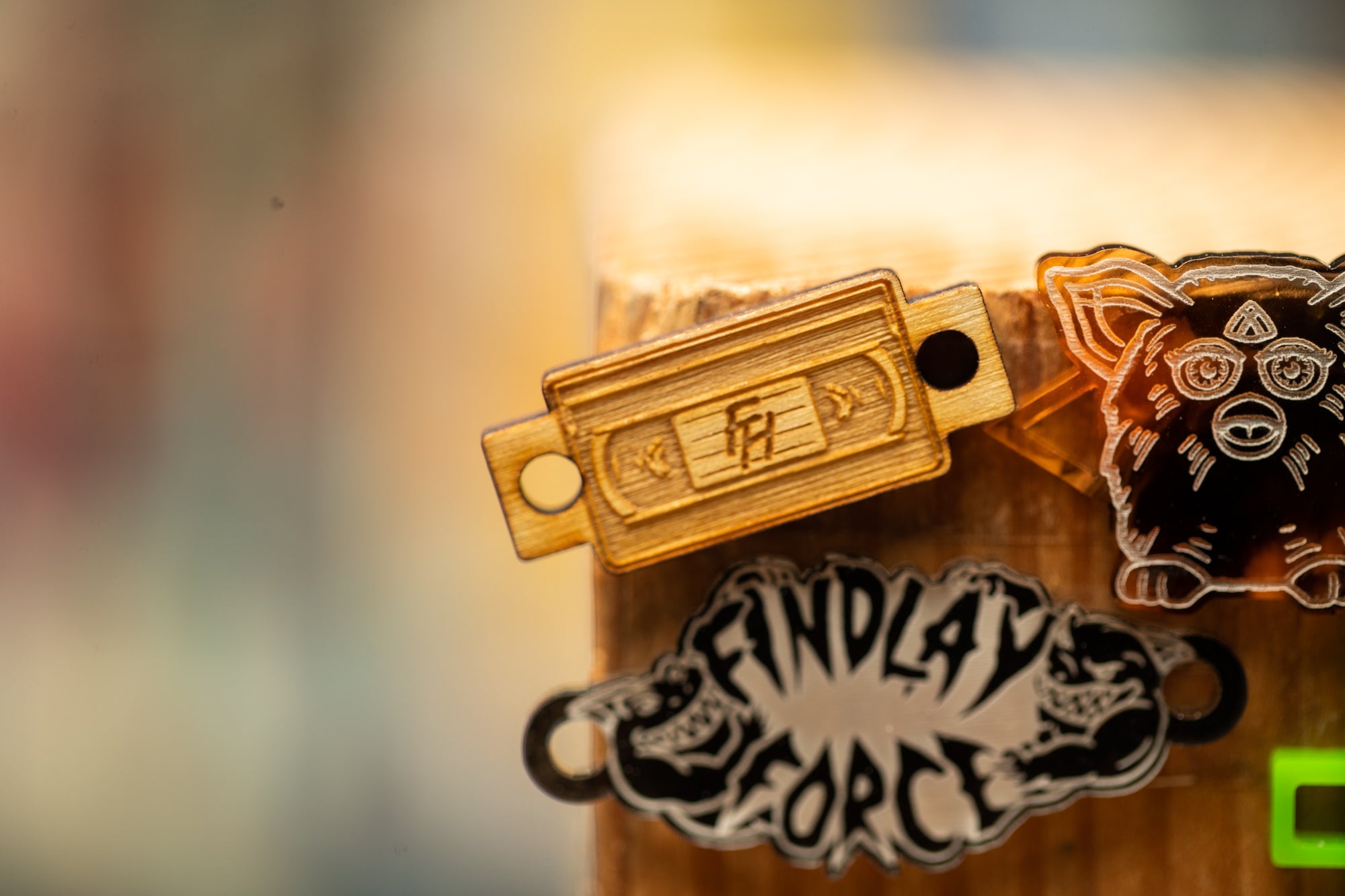a close up of a bunch of badges on a wooden pole