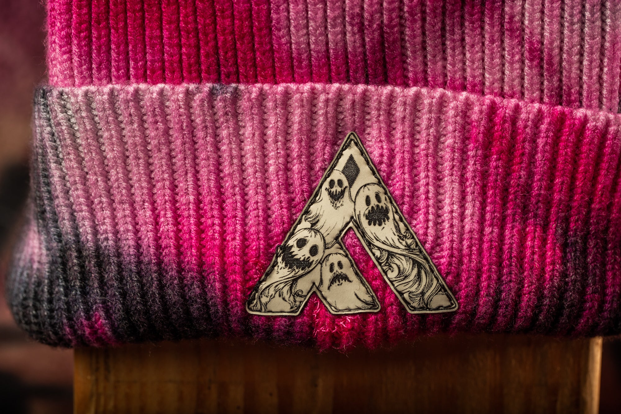 a close-up view of a knitted or crocheted item with a distinctive logo or design on it.
