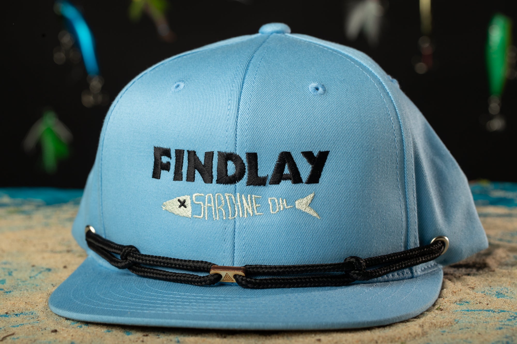 a blue hat with a fish on it
