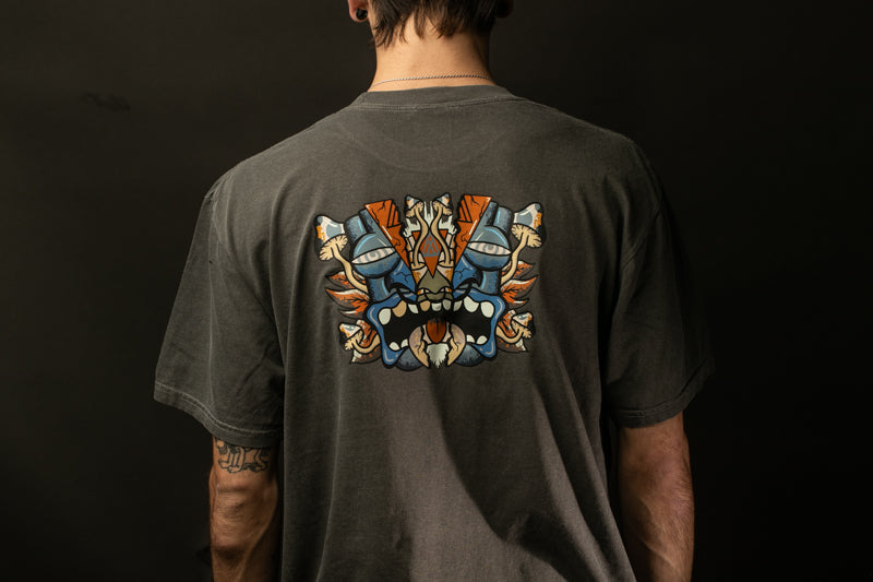 the back of a person wearing a gray t-shirt with a colorful graphic design on the back.