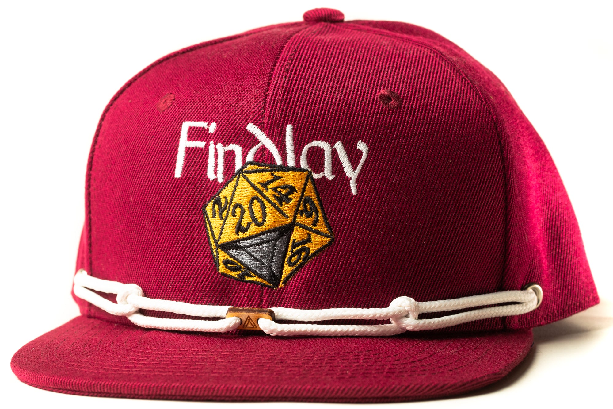 A maroon baseball cap with a white lace trim and a D20 dice embroidered on the front.