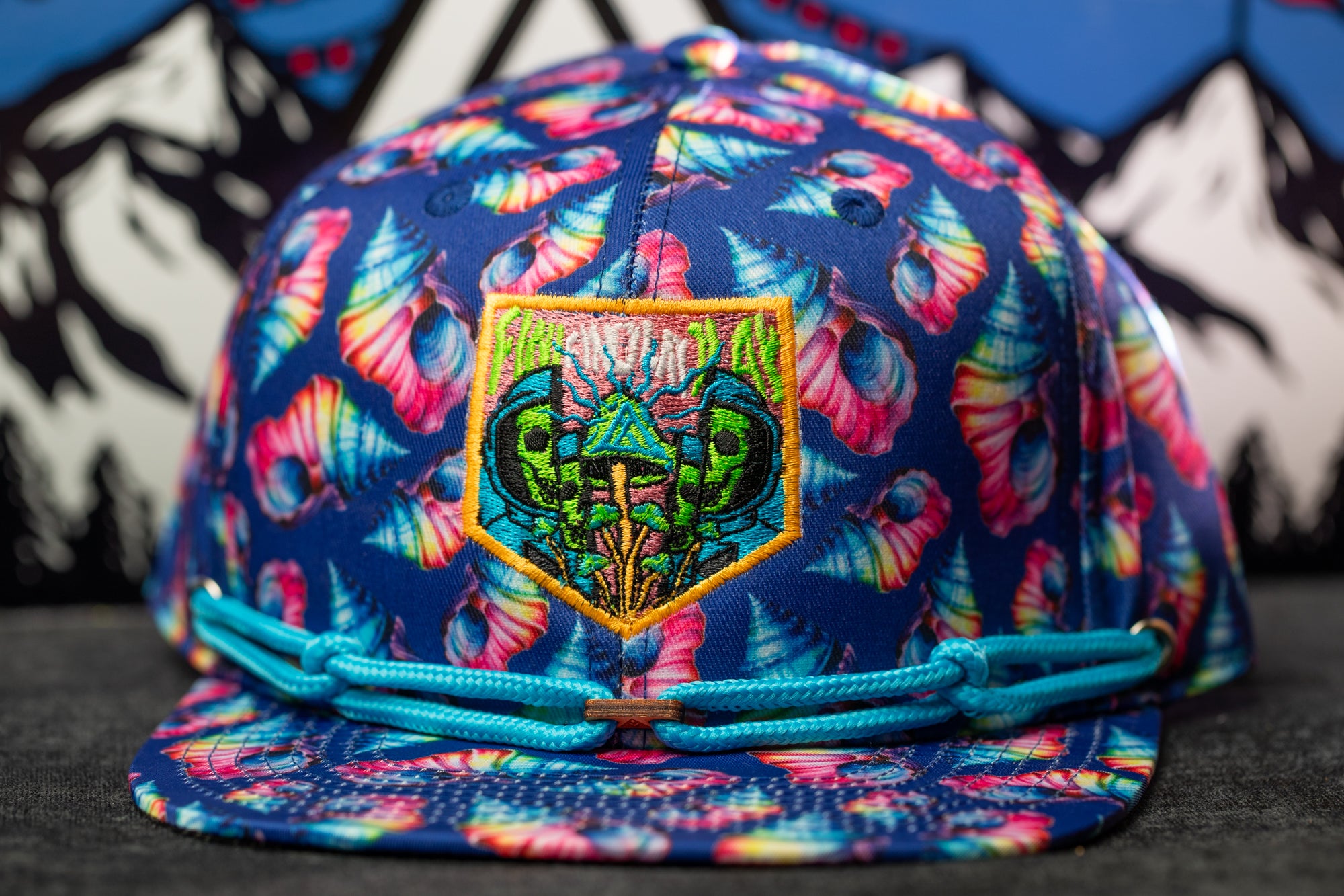 A colorful, patterned baseball cap with a unique design on the front.
