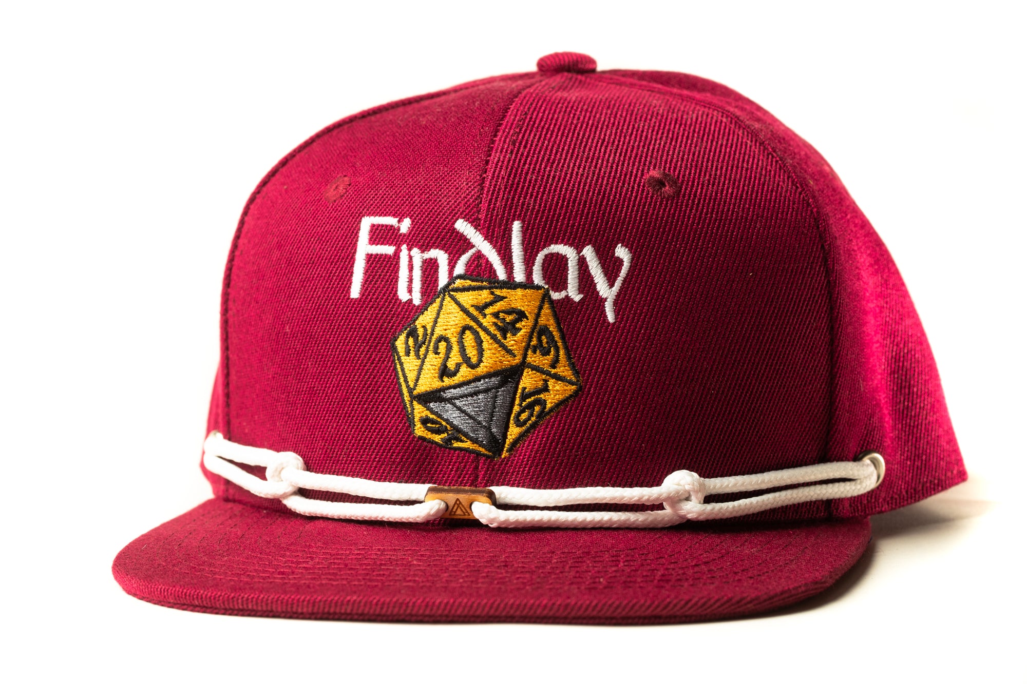 A red baseball cap with a white embroidered logo and a yellow dice on the front.