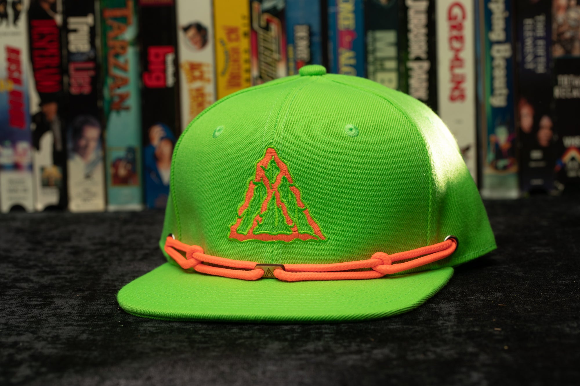 a neon green hat with a triangle on it