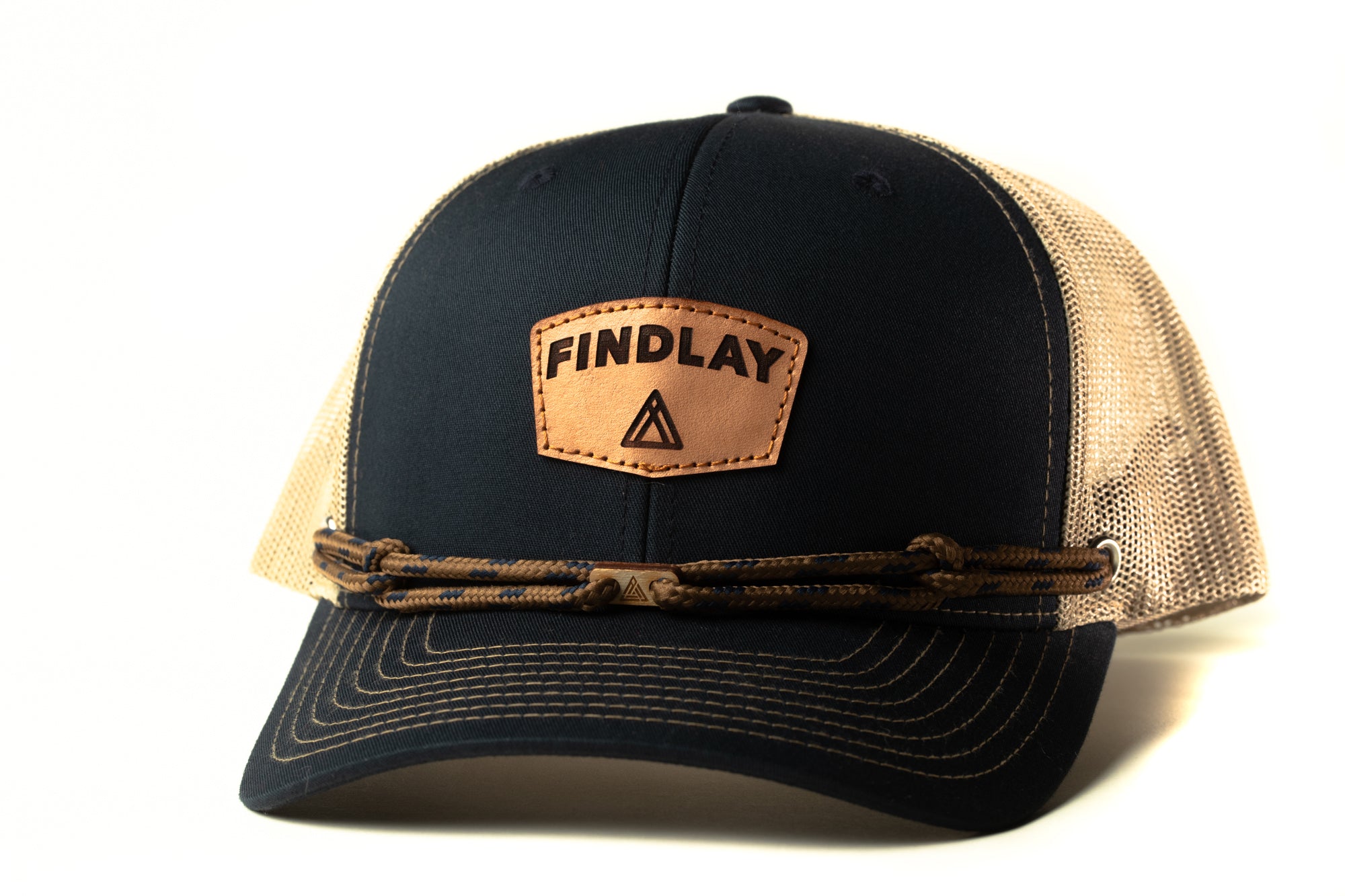 A black baseball cap with a mesh panel and a leather patch that says "FINDlay".