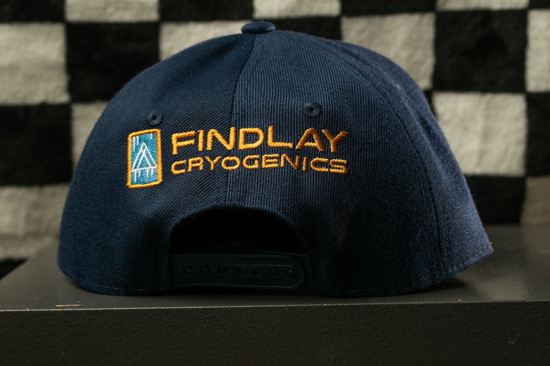 A navy blue baseball cap with the logo of Findlay Cryogenics printed on it.