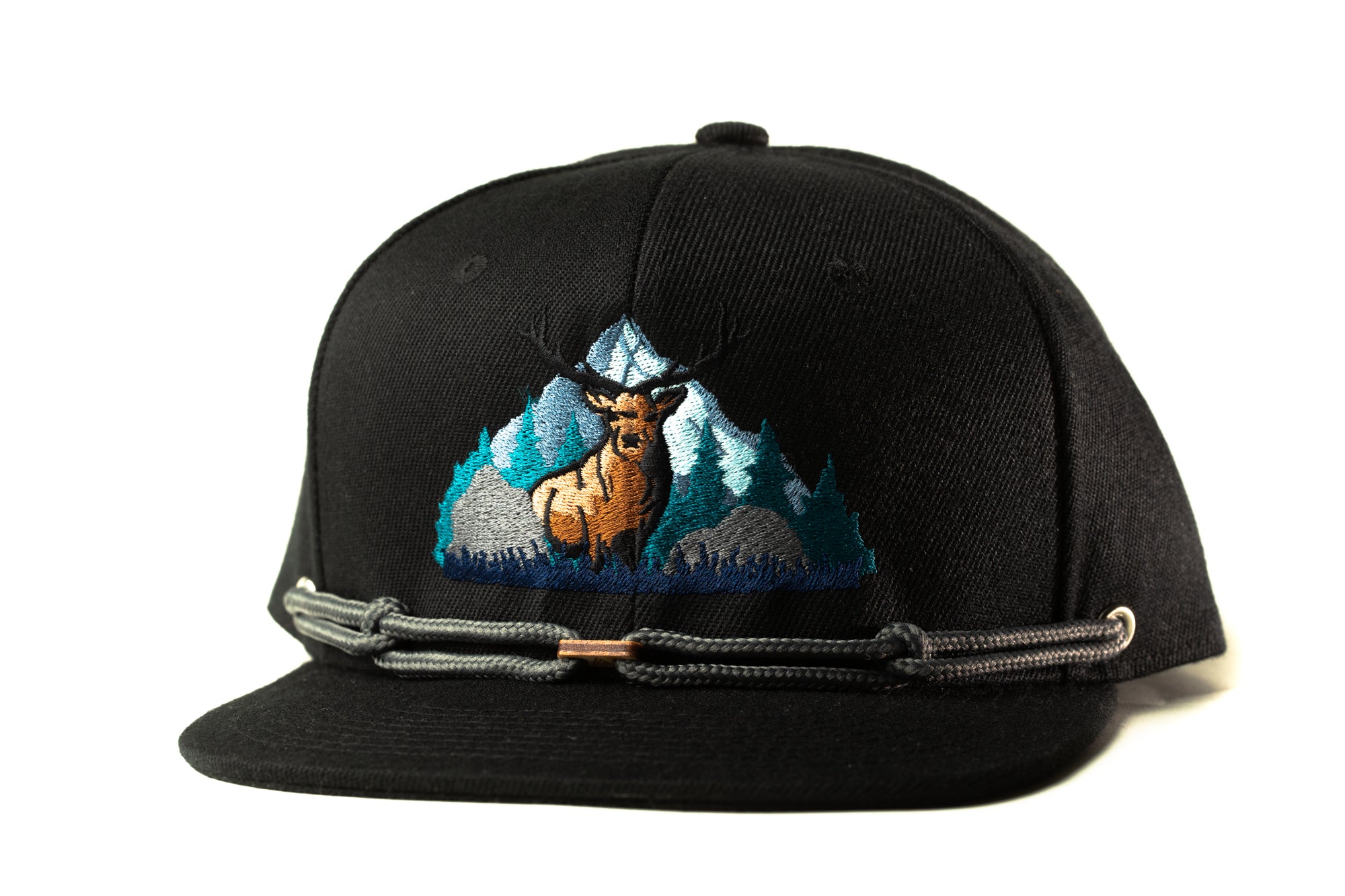 A black baseball cap with a graphic of a deer standing in front of a mountain landscape.