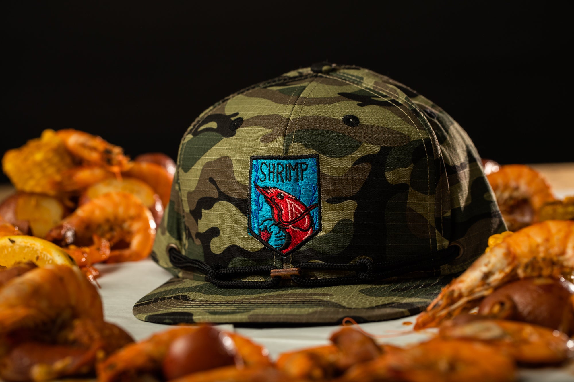 a camo hat sitting on top of a table