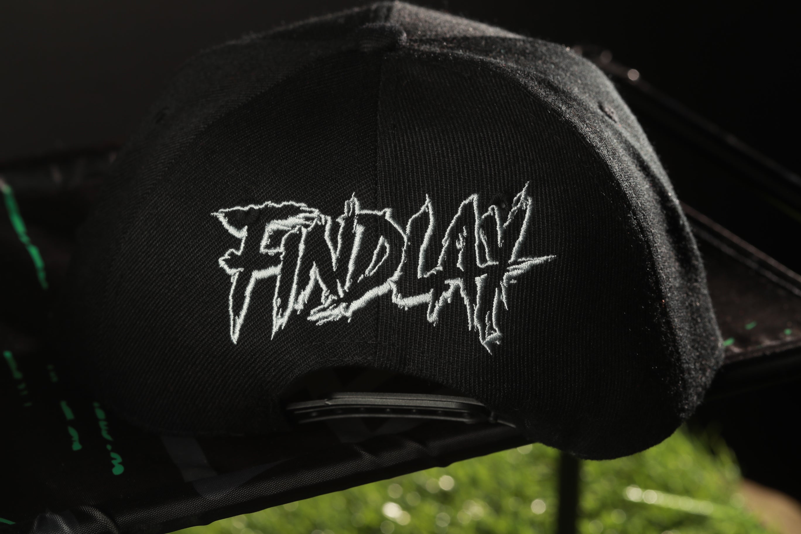 A black baseball cap with the word "FINDlay" printed on it in white text.
