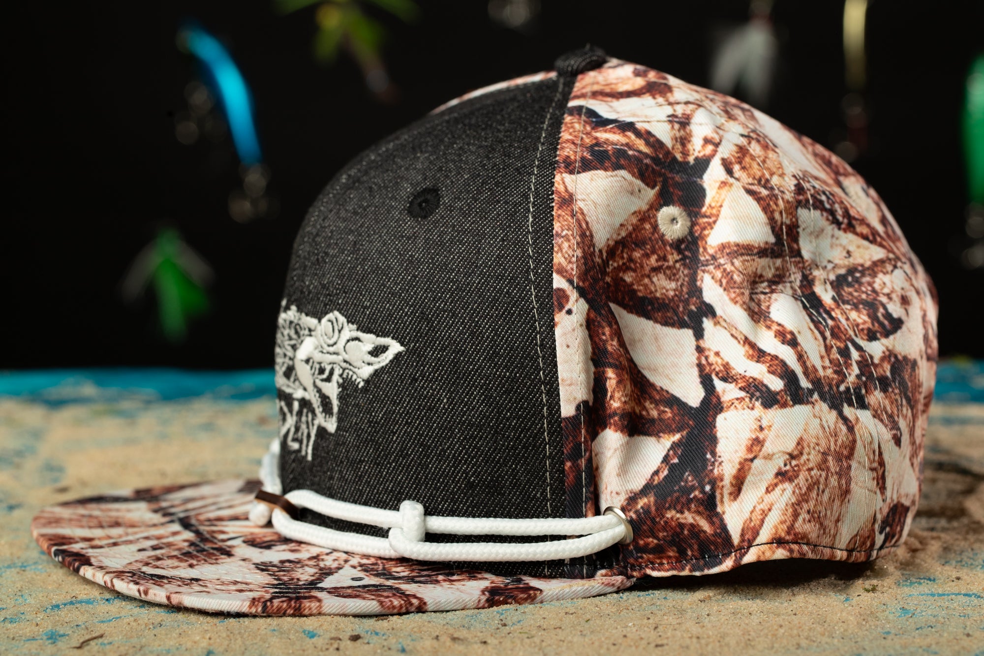 a black and white hat with a design on it