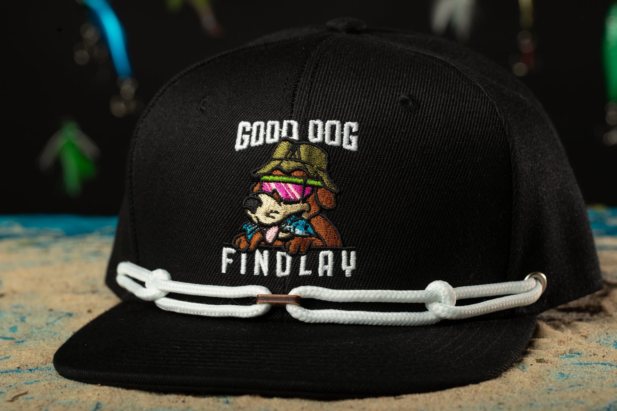 a black hat with a picture of a dog on it
