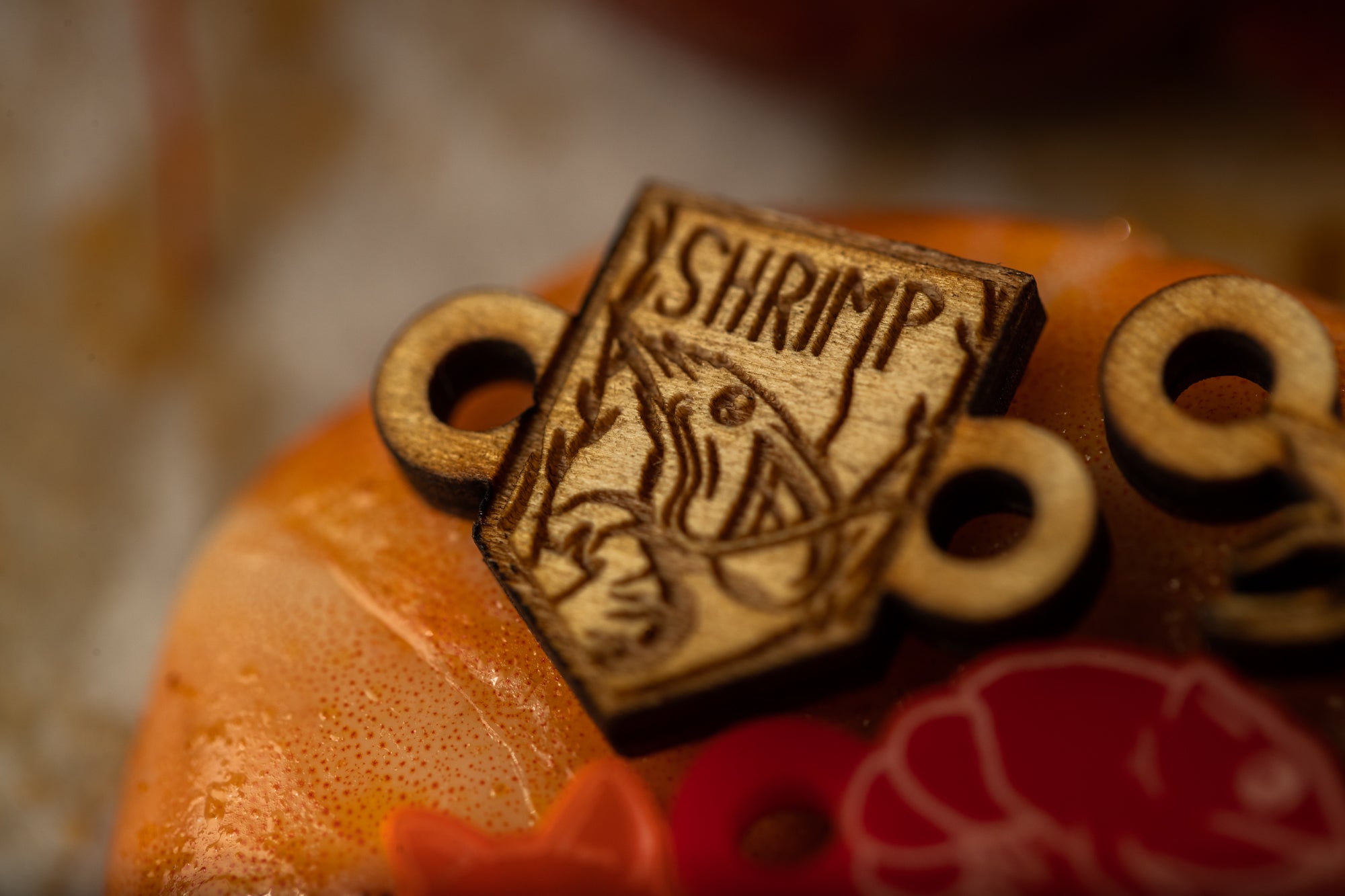 a close up of a small wooden object on a table