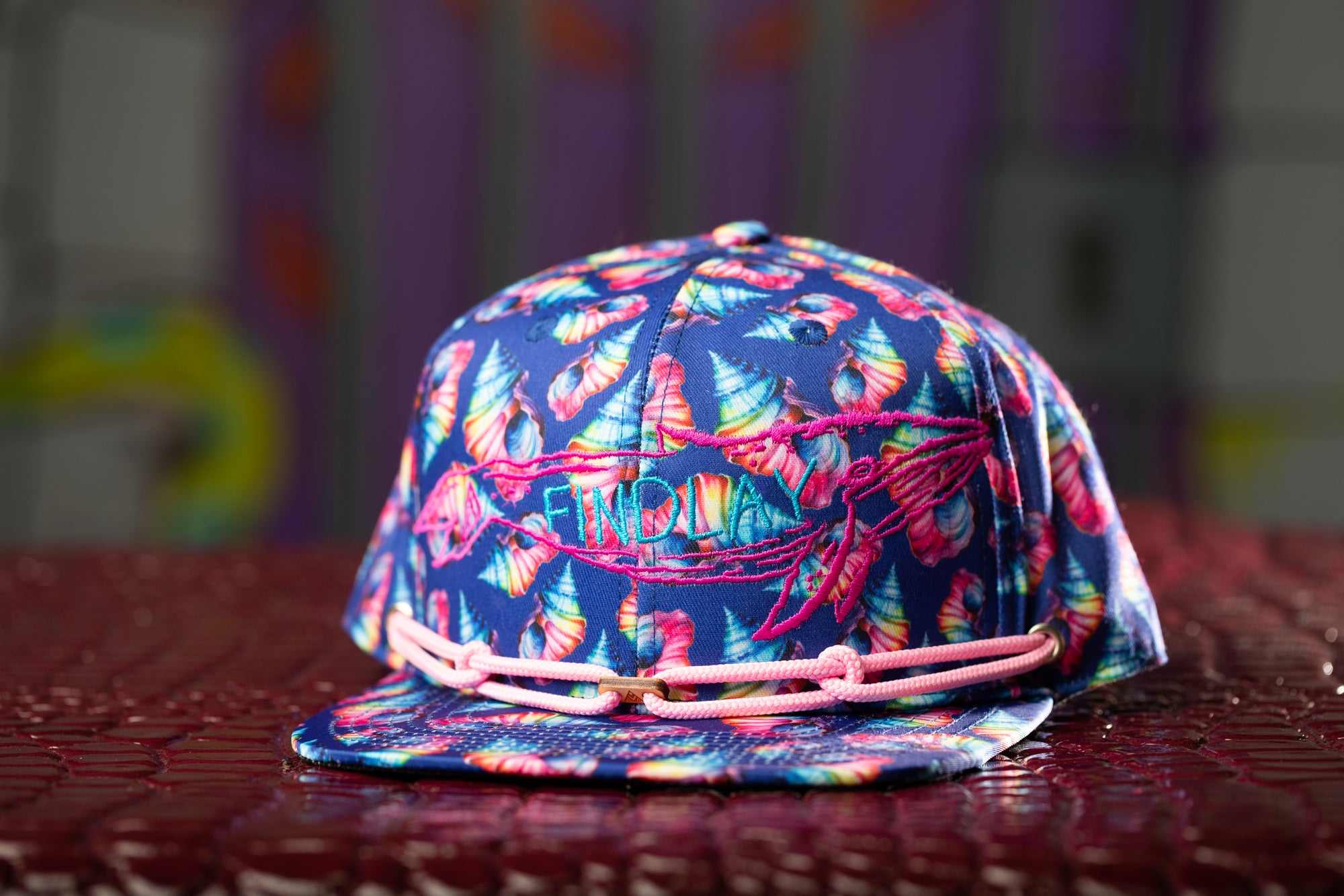 a hat with a tie dye pattern on it
