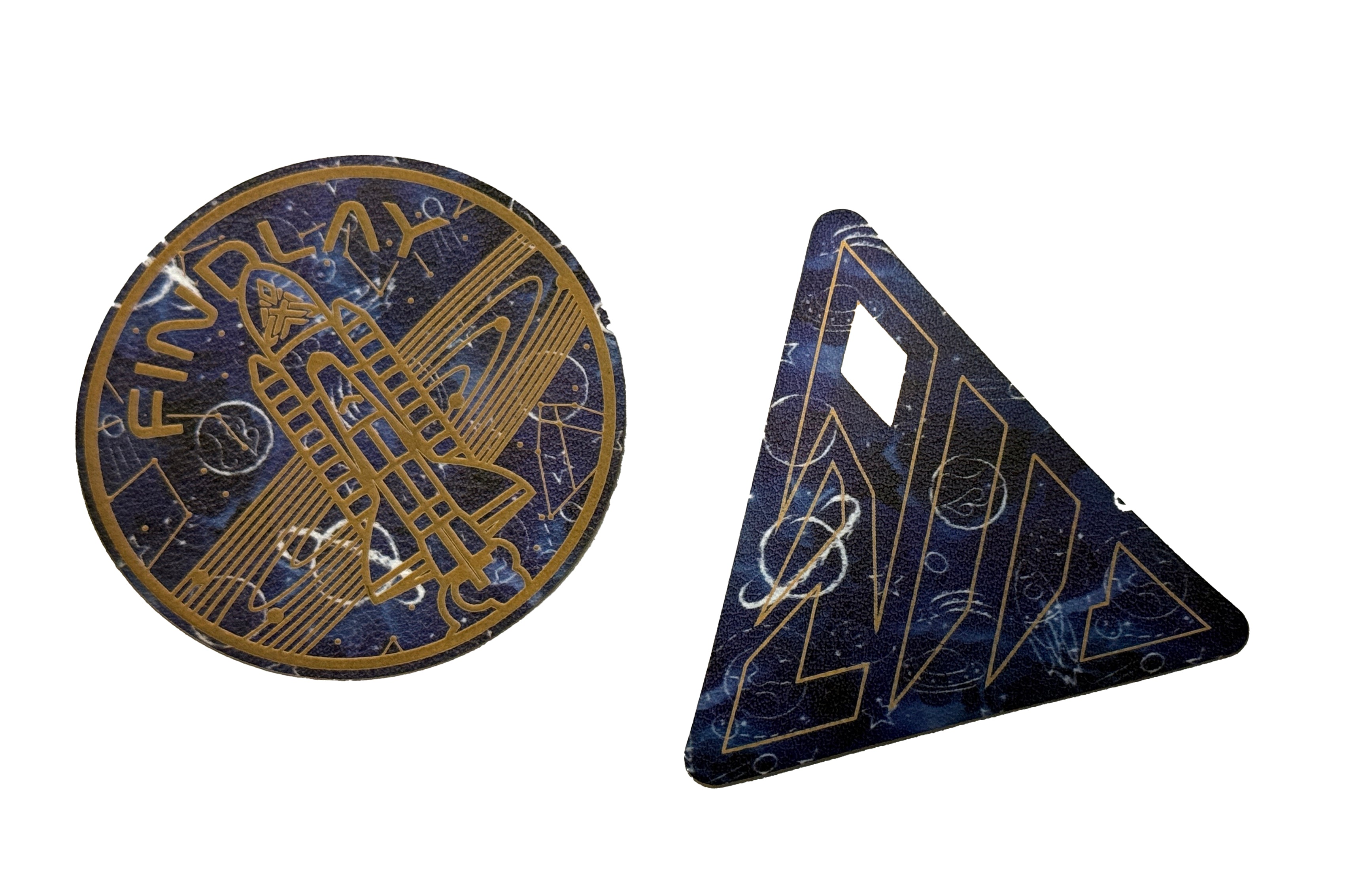 two circular and triangular shapes with various designs and patterns, including a space-themed motif.