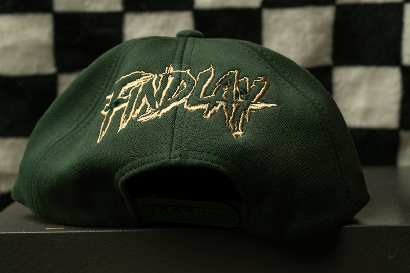 A green baseball cap with the word "FIND" embroidered on it.