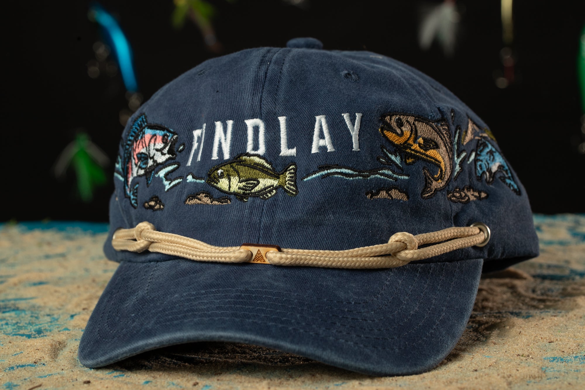 a baseball cap with a rope around the brim